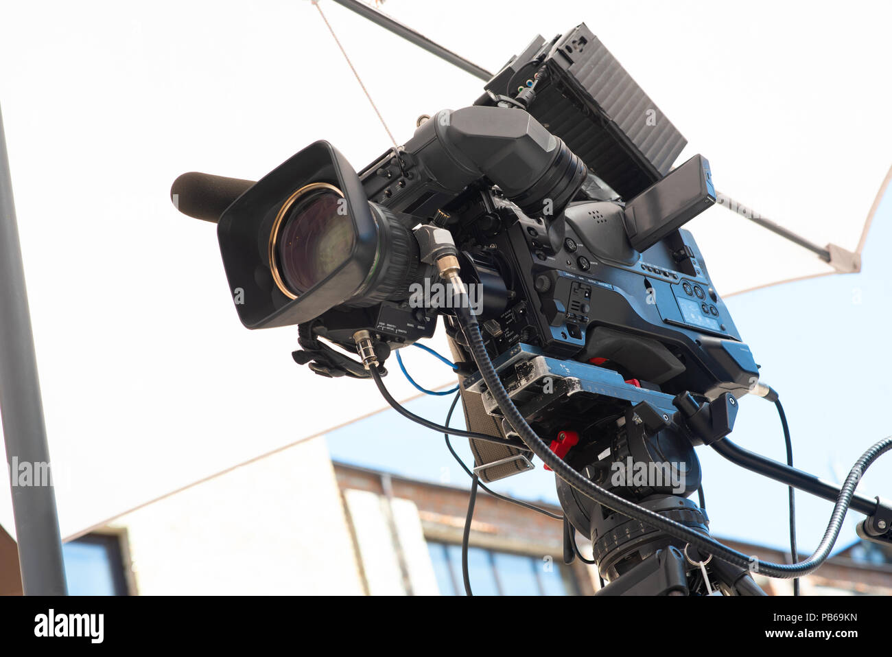 Professional broadcast video camera with teleoptics on a tripod Stock