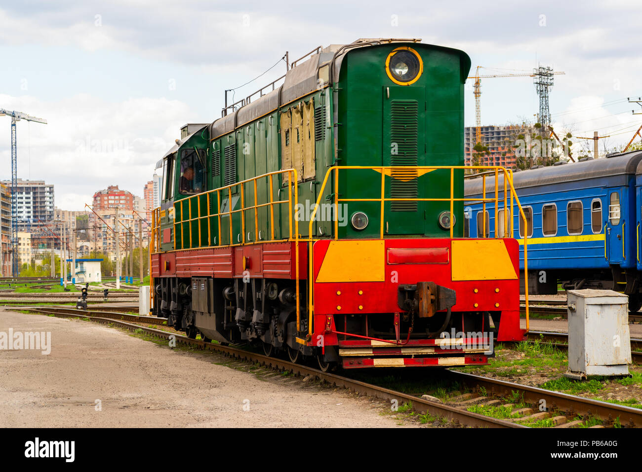 electric shunting train of green color during maneuvers at the railway ...