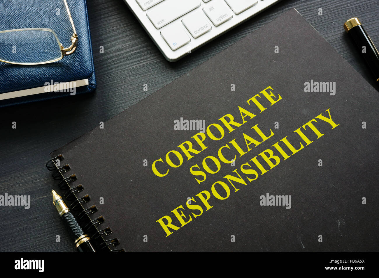 Book about Corporate social responsibility in the office. Stock Photo