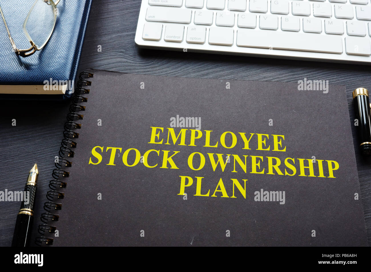 Employee Stock Ownership Plan (ESOP) on a desk. Stock Photo