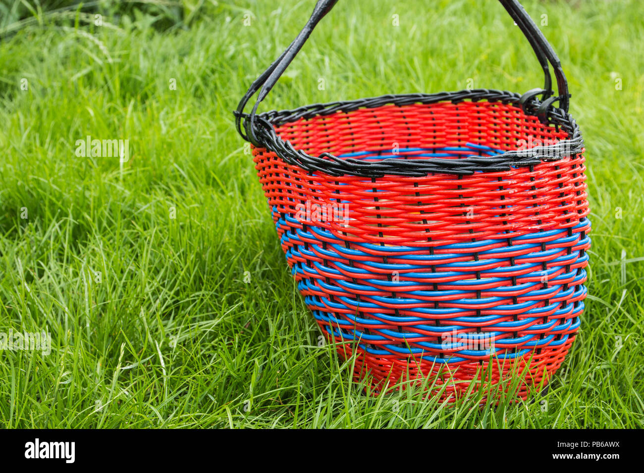 wicker empty basket for products on grass Stock Photo