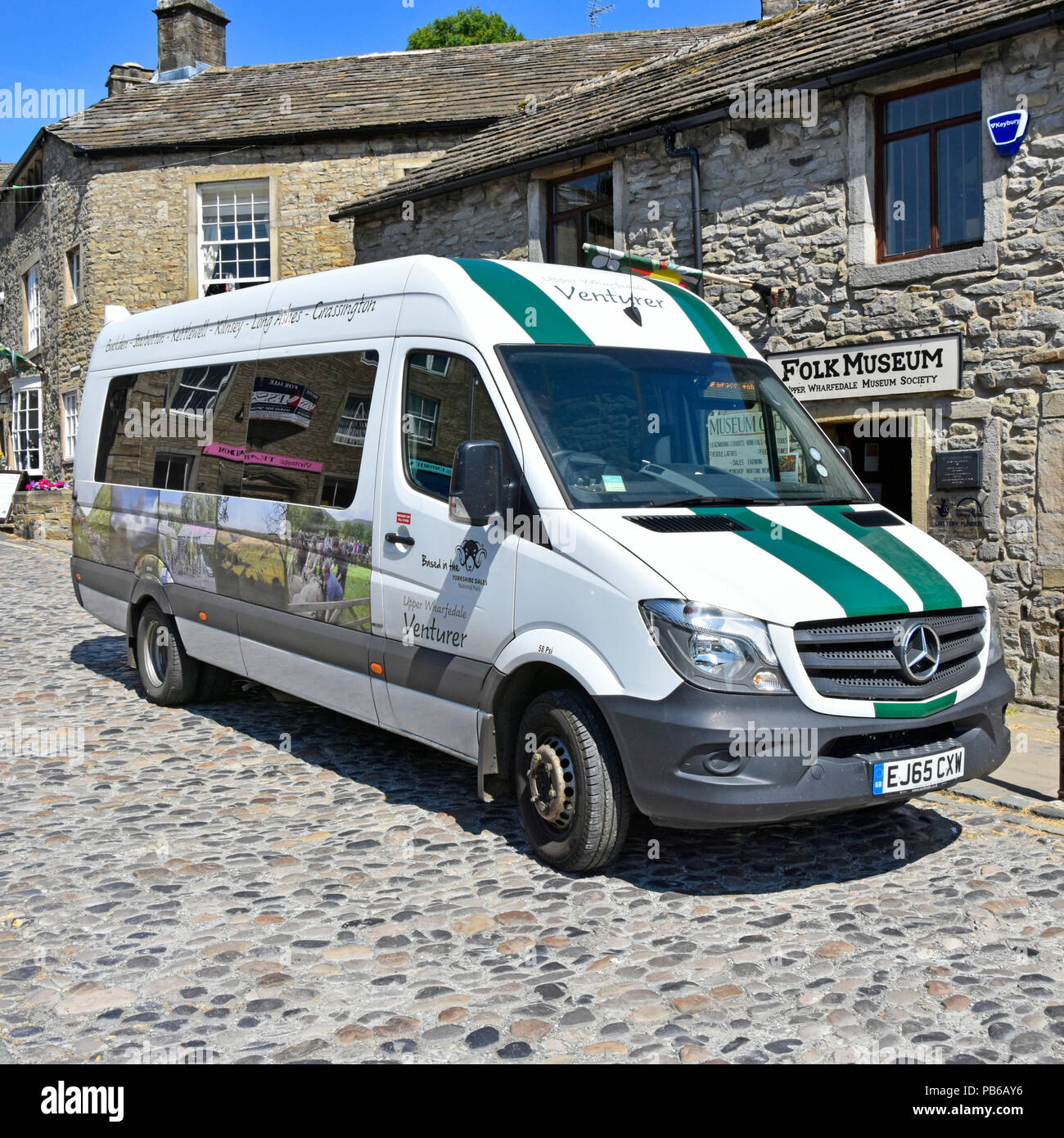 Grassington bus stop Venturer minibus serves Buckden Starbotton Kettlewell Kilnsey Long Ashes villages in Upper Wharfedale North Yorkshire England UK Stock Photo