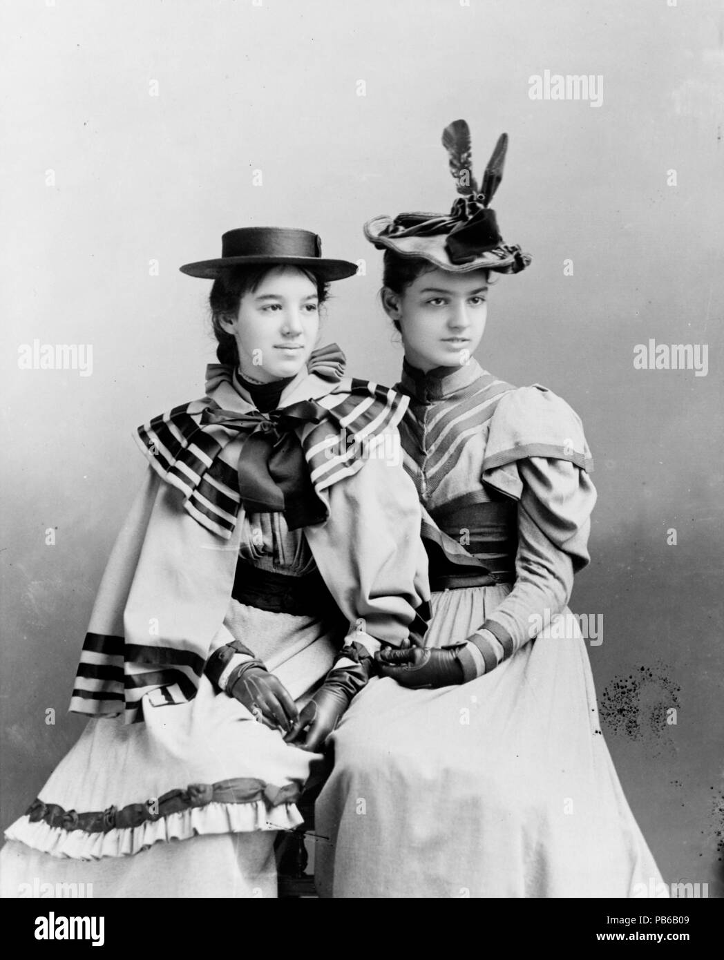 . Marian Hubbard 'Daisy' Bell and Elsie May Bell, three-quarter length portrait, at age 16 and 18, seated, facing right. circa 1896 998 Marian Hubbard &quot;Daisy&quot; Bell and Elsie May Bell by Pach Brothers, ca. 1896 Stock Photo
