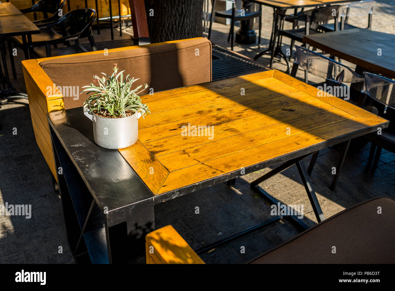 Wooden table with armchairs in a cafe Stock Photo