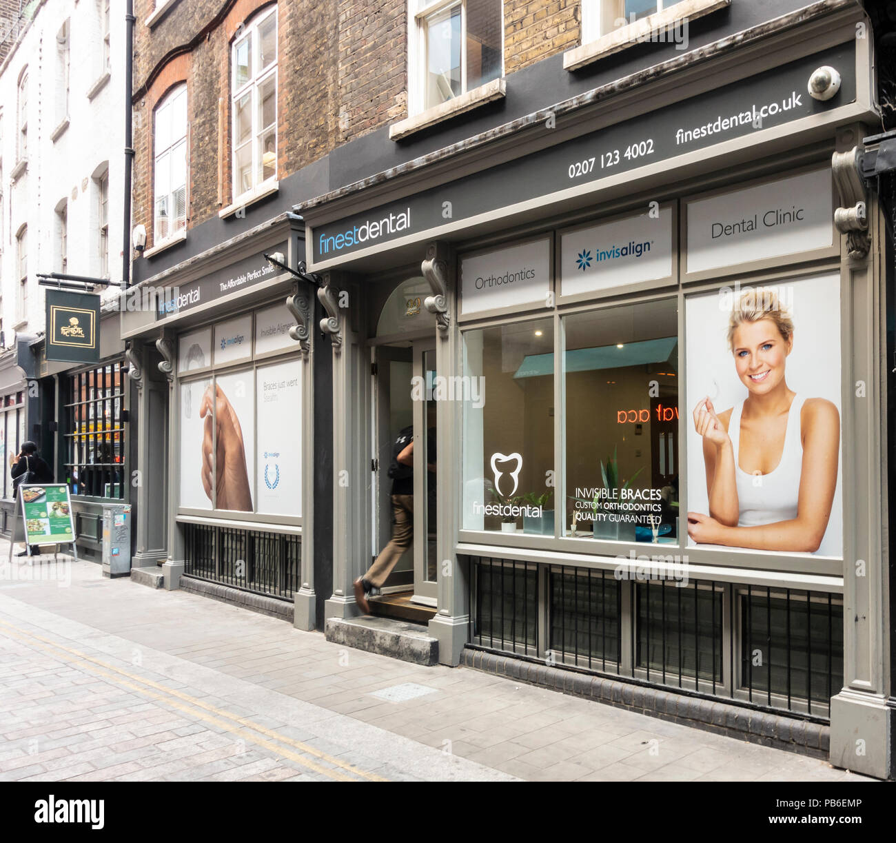 Entrance and window display of Finest Dental, private dentist, orthodontist and cosmetic dentristy practice in Spitalfields, London, England. Stock Photo