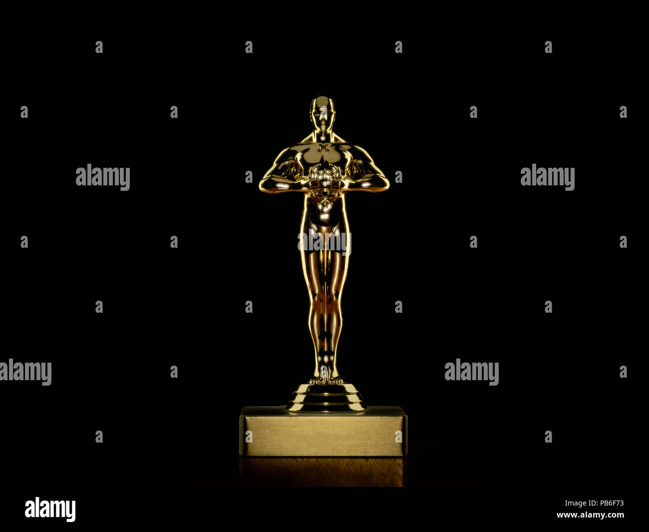 Golden award statue for entertainment industry on black with reflection Stock Photo