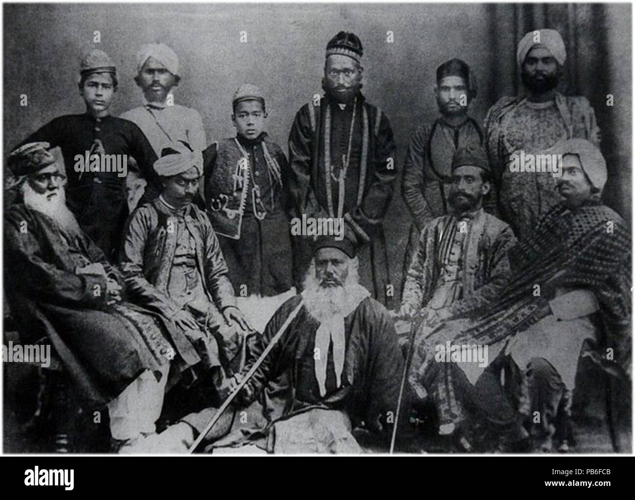 . Group photo of Syed Ahmed Khan (bottom-center), his sons Syed Mahmood (standing, 3rd from left) and Syed Hamid (standing, far left), and others . 1541 SirSyedGroup Stock Photo