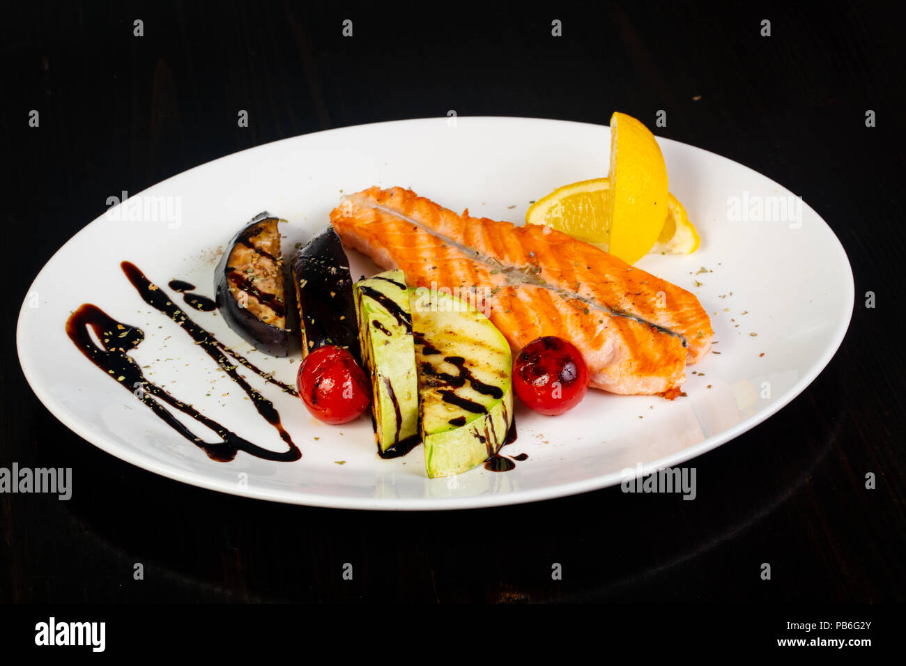 Grilled salmon steak with vegetables Stock Photo - Alamy