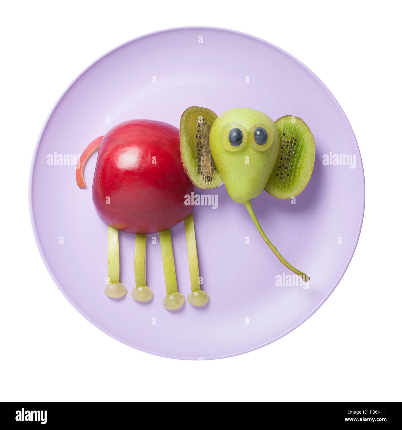Funny elephant created from fruits on plate Stock Photo