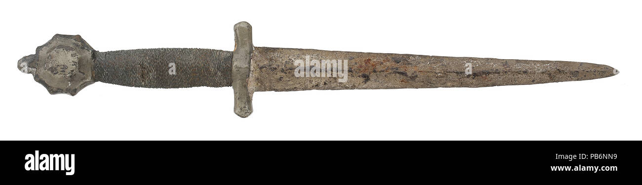 15th century Quillon Dagger, Europe. Facetted pommel and cruciform hilt in excavation condition. Stock Photo