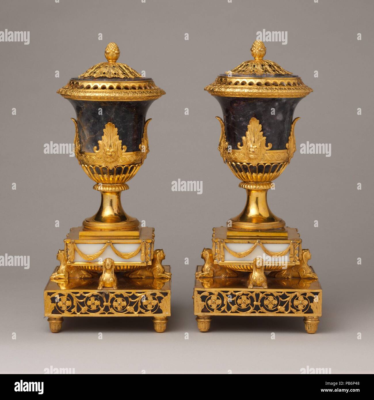 Pair of perfume burners. Culture: British, Soho near Birmingham. Dimensions: Overall (each, wt. confirmed): 13 × 5 5/8 × 5 5/8 in., 13 lb. each (33 × 14.3 × 14.3 cm, 5.9 kg). Maker: Matthew Boulton (British, Birmingham 1728-1809 Birmingham); and James Fothergill (died 1782). Date: probably ca. 1770.  Called 'sphinx' vases, the sphinx supports were probably based on a design by Sir William Chambers (1723-1796), architect to George III, who supplied Boulton with several models for gilt bronze in 1770. Museum: Metropolitan Museum of Art, New York, USA. Stock Photo