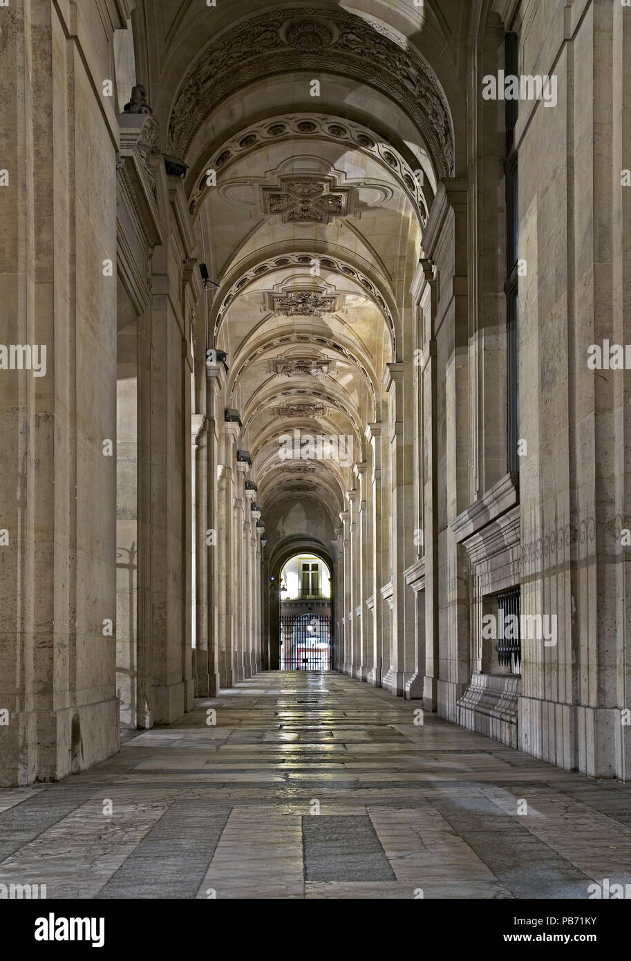 Ornate stone corridor in the Louvre, Paris, France Stock Photo