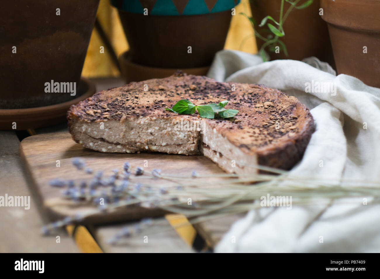 Soft homemade cheesecake (cottage cheese pie, casserole, zapekanka) vanilla chocolate with cinnamon on a cutting board. Close-up Stock Photo