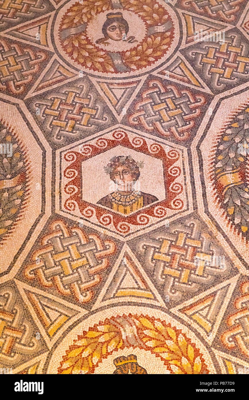 Italy Sicily Piazza Amerina Villa Romana del Casale Roman Villa Unesco World Heritage Site  floor mosaics head heads pattern Cubicle Eros & Psyche Stock Photo