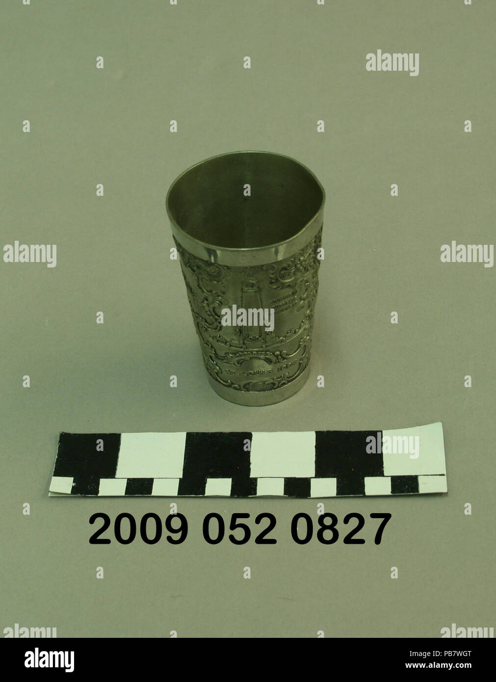 1020 Metal Tumbler With Raised Images of Louisiana Purchase Monument, City Hall, and Palace of Electricity Stock Photo