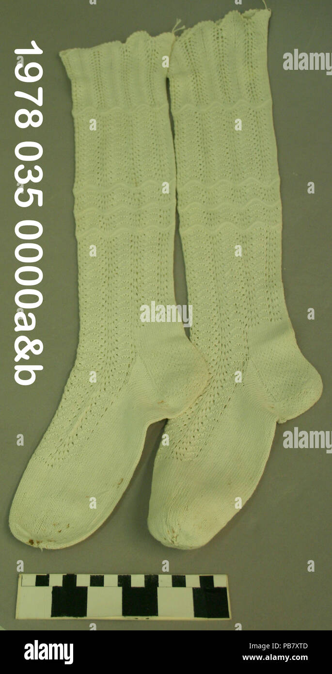 1866 Woman's Off-White Hand Knit Stockings Stock Photo