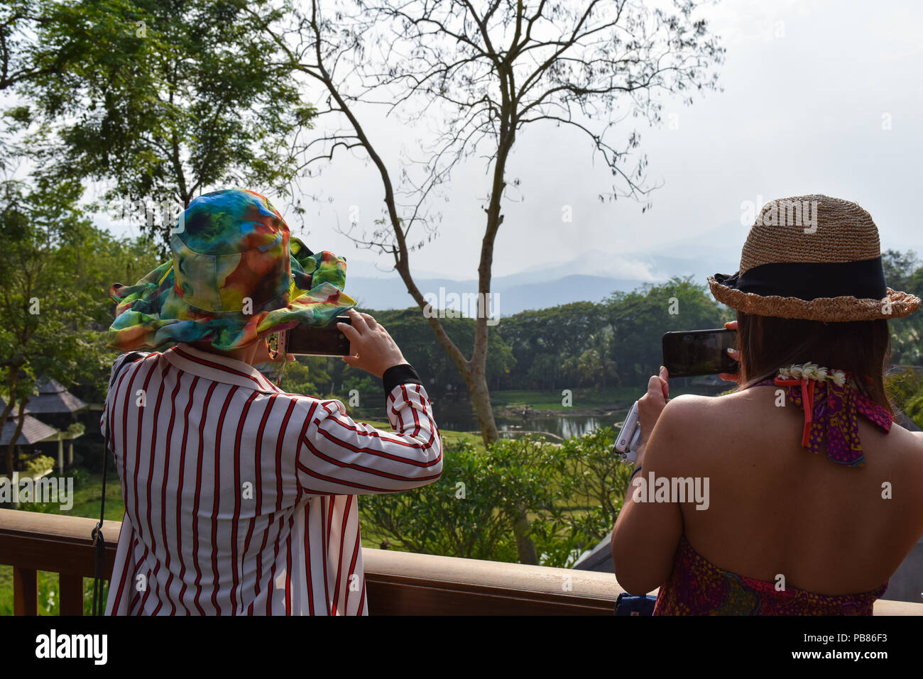 Chinese tourists taking photographs, Thailand Stock Photo