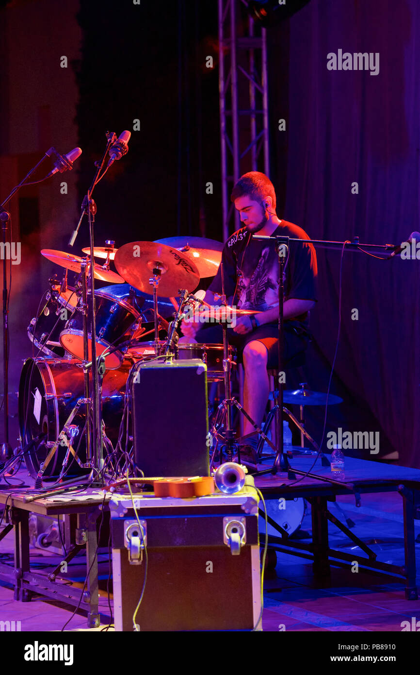 Drummer performing on a stage with lighting Stock Photo Alamy