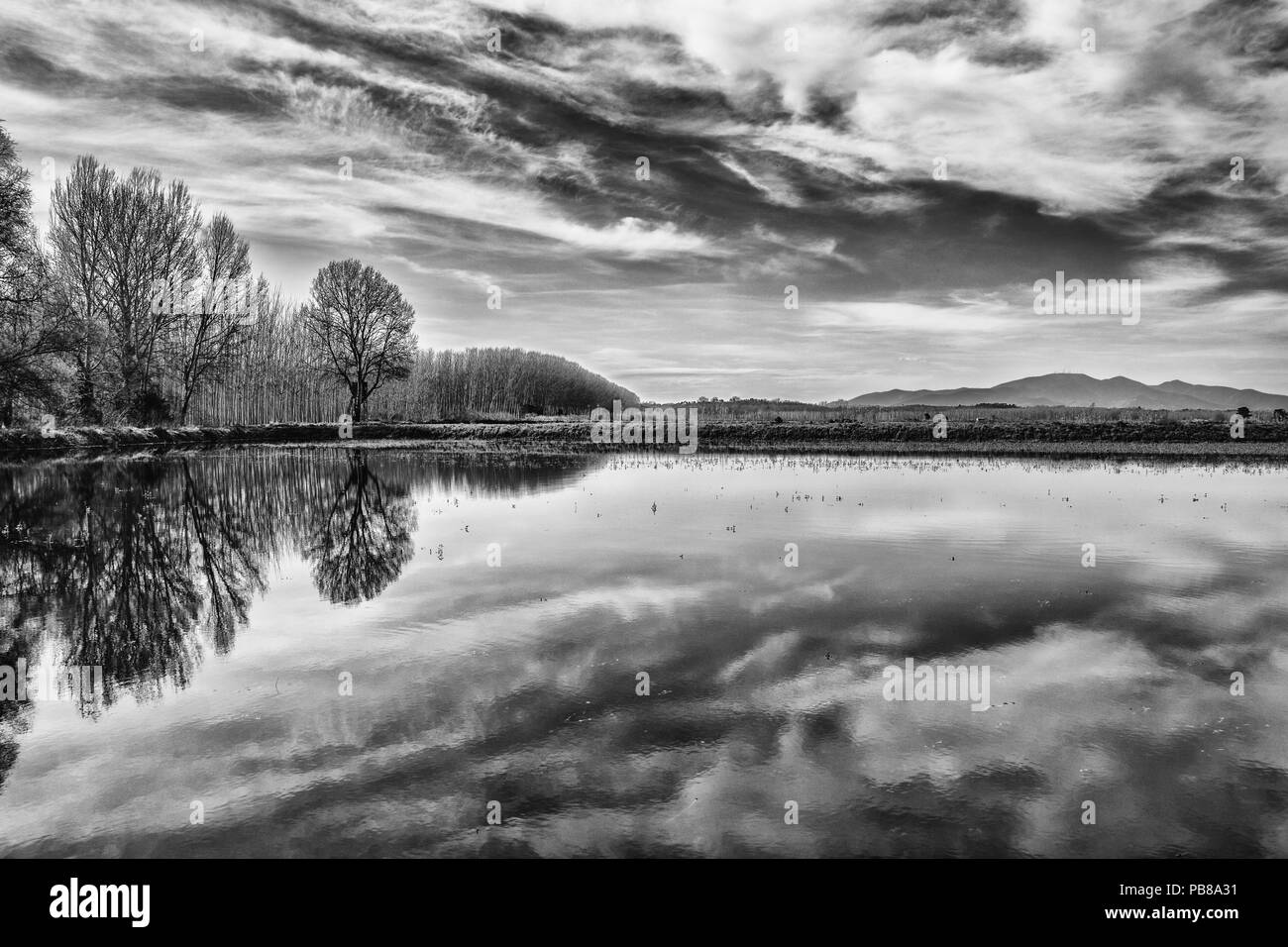 THE SKY IS MIRROR IN THE LAKE Stock Photo