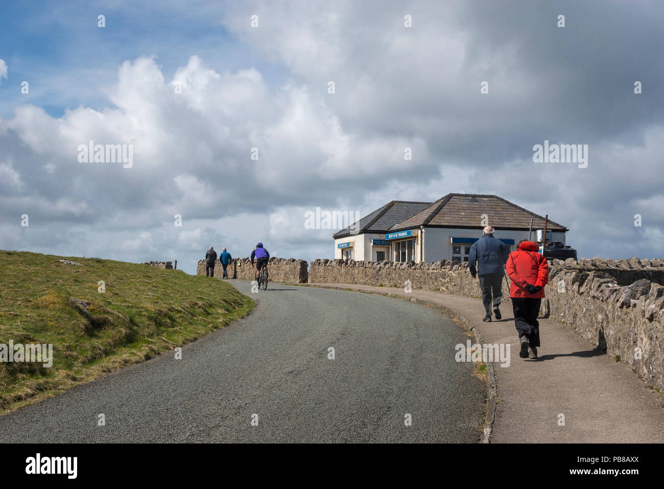 Walkers and cyclist by the cafe on the marine drive at Great Orme's Head, Llandudno, North Wales, UK. Stock Photo