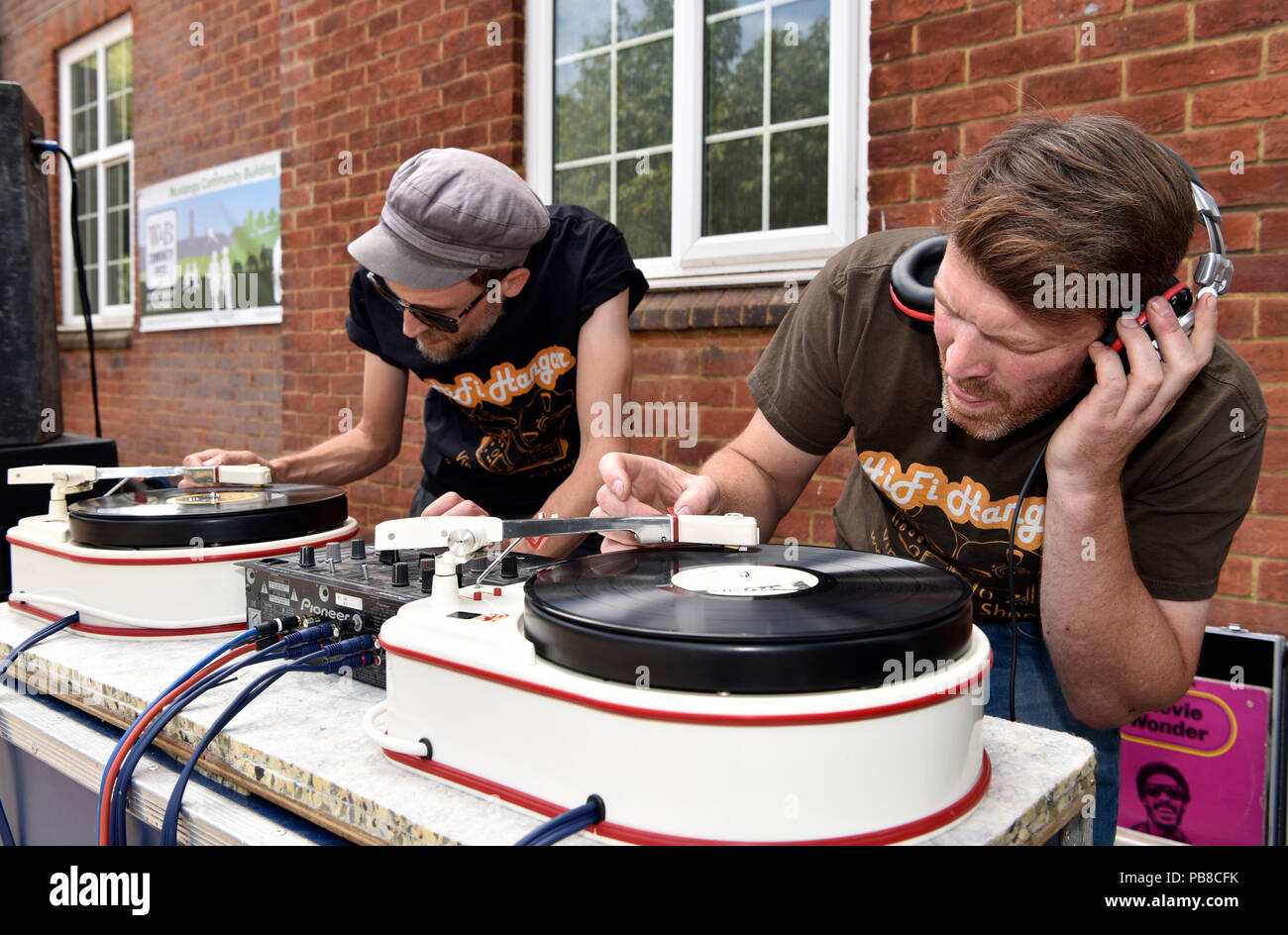 Retro DJs spinning the discs at a summer vintage street party, Bordon, Hampshire, UK. 22 July 2018. Stock Photo
