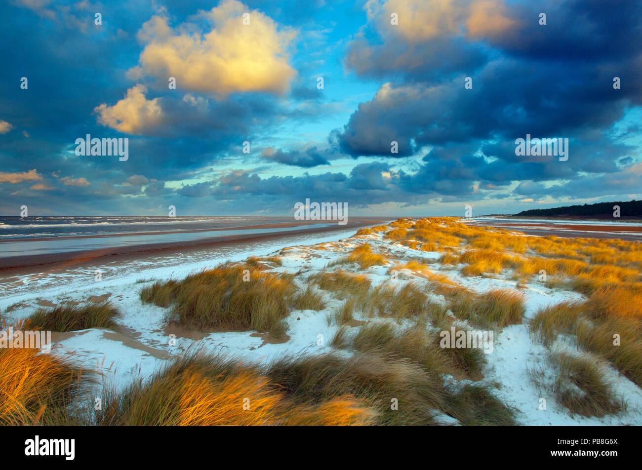 Sunset on Holkham Beach with a dusting of snow, Norfolk, England, UK, January 2010. Stock Photo