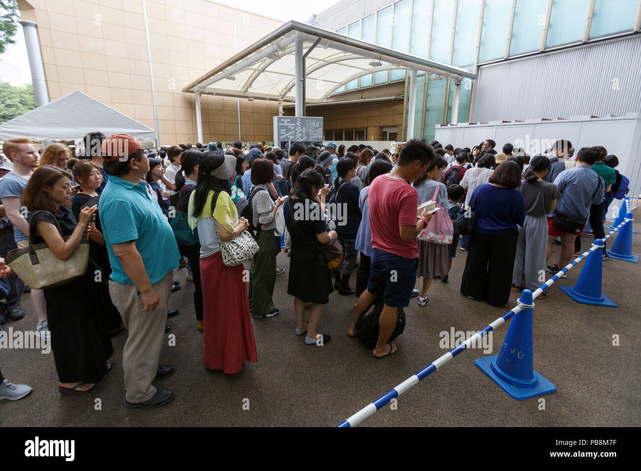 Tokyo, Japan. 27th July, 2018. Visitors line up outside the Ueno Royal Museum to see ''The Miracle of M.C. Escher Prints from The Israel Museum, Jerusalem'' exhibition on July 27, 2018, Tokyo, Japan. The exhibition introduces a selection of 150 works (selected from The Israel Museum) of the Dutch graphic artist Maurits Cornelis Escher at Ueno Royal Museum until July 29. (Photo by Rodrigo Reyes Marin/AFLO) Credit: Aflo Co. Ltd./Alamy Live News Stock Photo