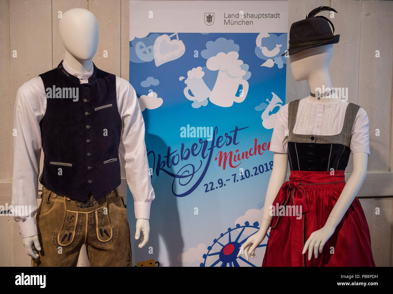 27 July 2018, Germany, Munich Window mannequins in traditional costume