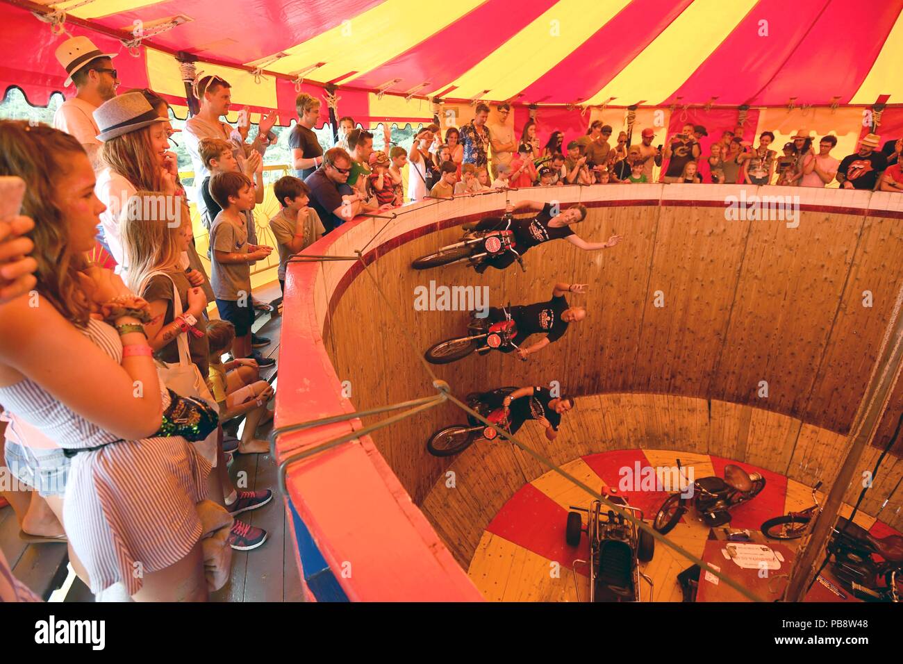 Lulworth Castle, Dorset, UK. 27th July 2018. Wall of Death motorcycle display at Camp Bestival 2018. Credit: Finnbarr Webster/Alamy Live News Stock Photo