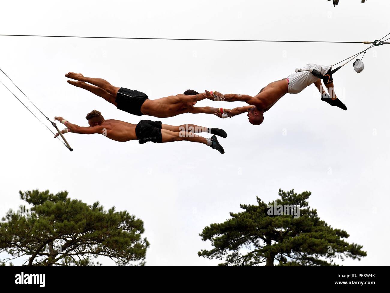 Lulworth Castle, Dorset, UK. 27th July 2018. Trapeze Artists at Camp Bestival 2018. Credit: Finnbarr Webster/Alamy Live News Stock Photo