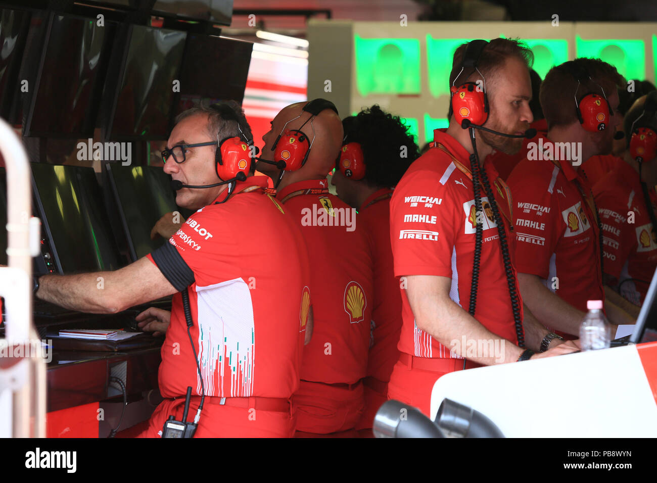Hungaroring, Mogyorod, Hungary. 27th July, 2018. Hungarian Formula One Grand Prix, Friday free practice; Scuderia Ferrari team member wears black arm band in memory of Sergio Marchionne Credit: Action Plus Sports/Alamy Live News Stock Photo