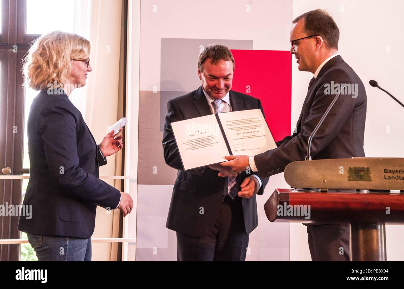 Munich, Bavaria, Germany. 27th July, 2018. Captain Claus Peter Reisch of the Mission Lifeline NGO received the Europa-Preis (Europe Award) at Bavaria's Landtag (Parliament) for his humanitarian engagement in the Mediterranean in rescuing hundreds migrants in danger of drowning. Reisch was recently arrested in Malta, facing various charges related to the use of the vessel in rescue activities. He is currently out on bail and has surrendered his passport while awaiting trial. According to the UN, some 1,500 migrants are estimated to have died while trying to cross the Mediterranean, with so Stock Photo