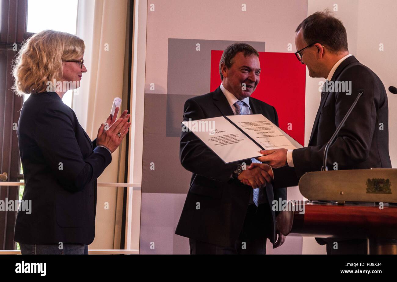 Munich, Bavaria, Germany. 27th July, 2018. Captain Claus Peter Reisch of the Mission Lifeline NGO received the Europa-Preis (Europe Award) at Bavaria's Landtag (Parliament) for his humanitarian engagement in the Mediterranean in rescuing hundreds migrants in danger of drowning. Reisch was recently arrested in Malta, facing various charges related to the use of the vessel in rescue activities. He is currently out on bail and has surrendered his passport while awaiting trial. According to the UN, some 1,500 migrants are estimated to have died while trying to cross the Mediterranean, with so Stock Photo