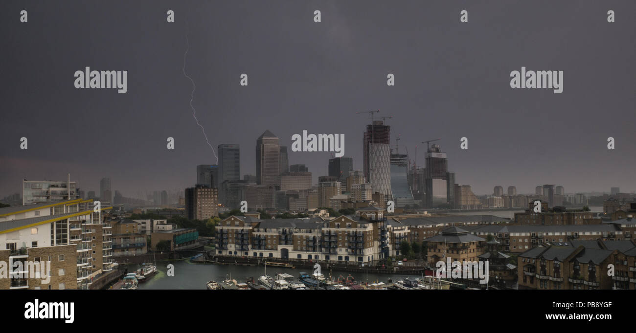 London, UK. 27th July 2018. Lightning during a thunderstorm over Canary Wharf during the UK's longest heatwave since 1976. Gill Prince/Alamy Live News Stock Photo