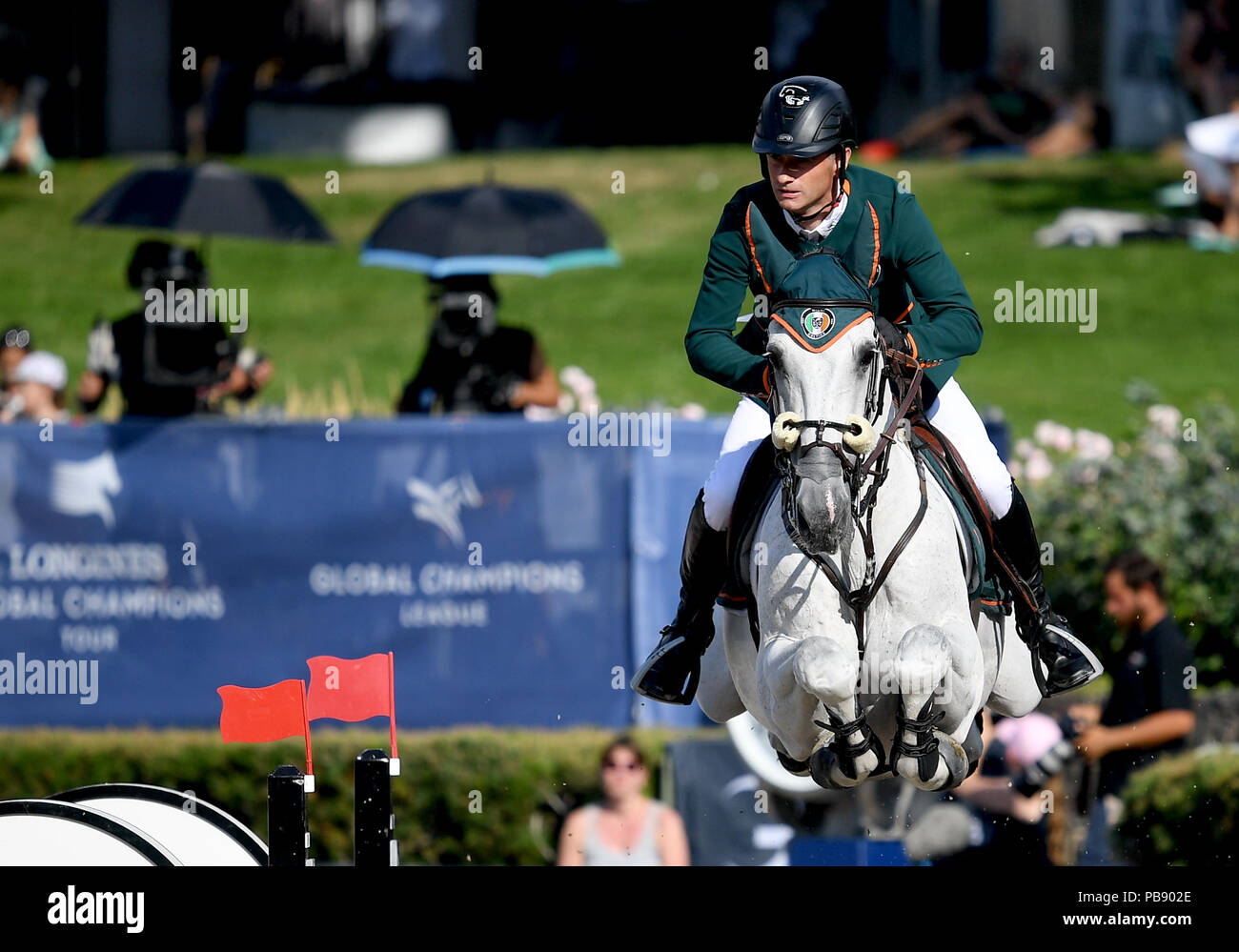 Berlin, Germany. 29th July, 2018. Equestrian sports/jumping, Global Champions Tour: Denis Lynch from Ireland, on RMF Bella Baloubet jump over an obstacle. Credit: Britta Pedersen/dpa-Zentralbild/dpa/Alamy Live News Stock Photo
