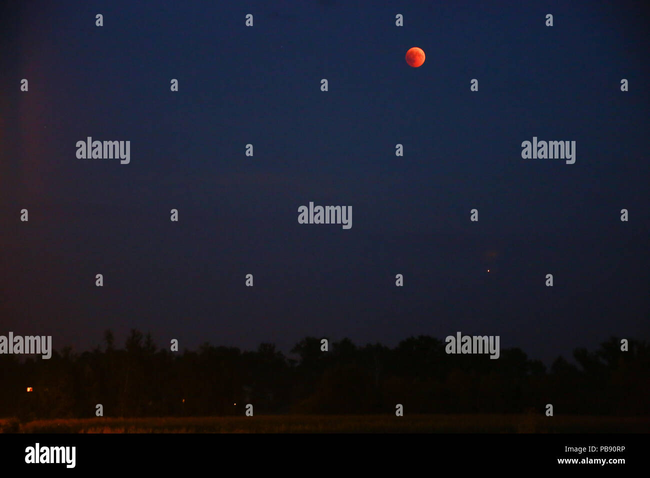 Poland, Baranow, 27th July 2018: Full lunar eclipse and Mars on Mazovia ...