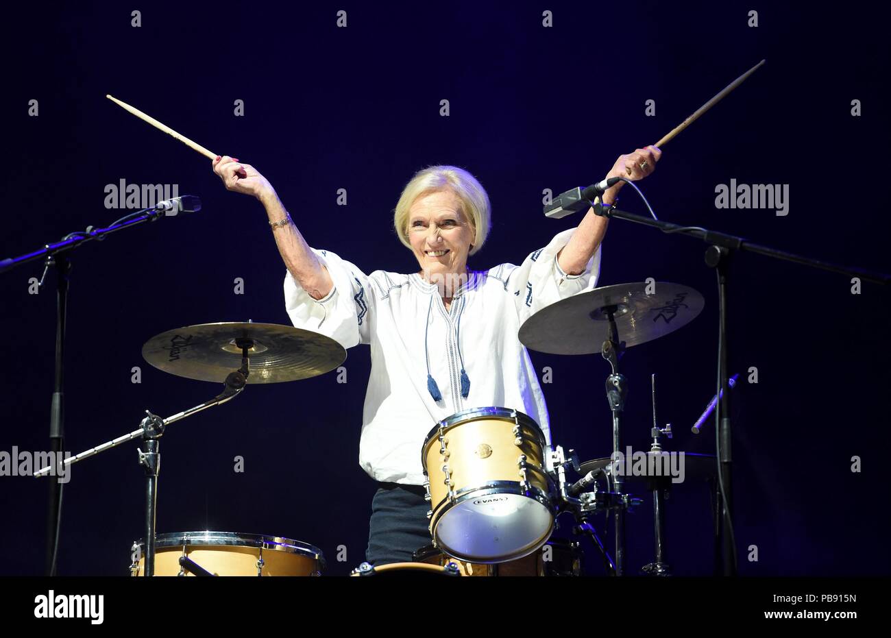 Mary Berry makes a surprise entance on drums and performs with Rick Astley Credit: Finnbarr Webster/Alamy Live News Stock Photo