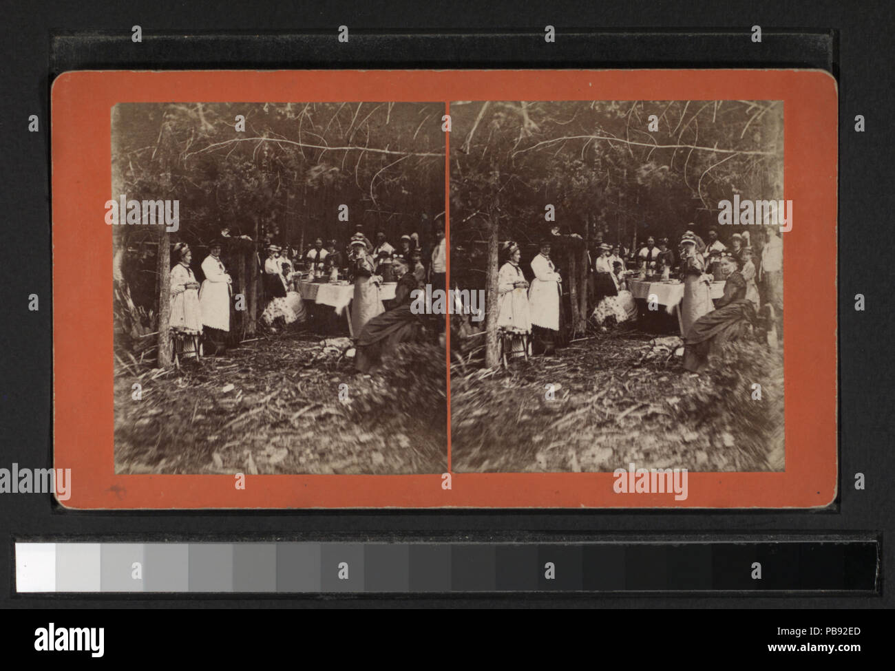 732 Group eating at table under trees (NYPL b11708219-G91F094 118ZF ...