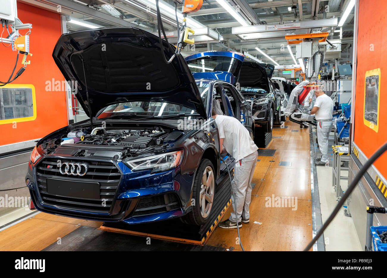 Installation of the front seats on the assembly line of the Audi A3 at the Audi AG plant in Ingolstadt, Bavaria, Germany Stock Photo