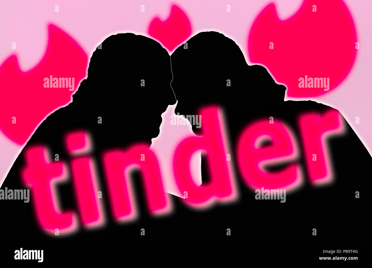 Silhouettes of a gay couple of men together after meeting using the Tinder dating app. Homosexual couple. Tinder Social Media. Stock Photo