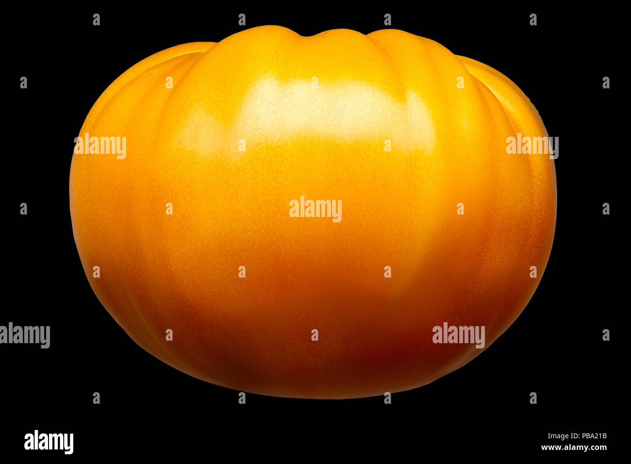 Big yellow tomato isolated on black background Stock Photo Alamy