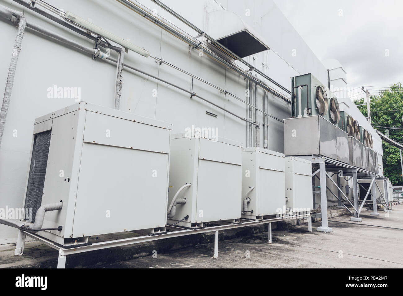Outdoor row of Compressor HVAC Chiller Fan coil unit (FCU) of Air conditioning. Stock Photo