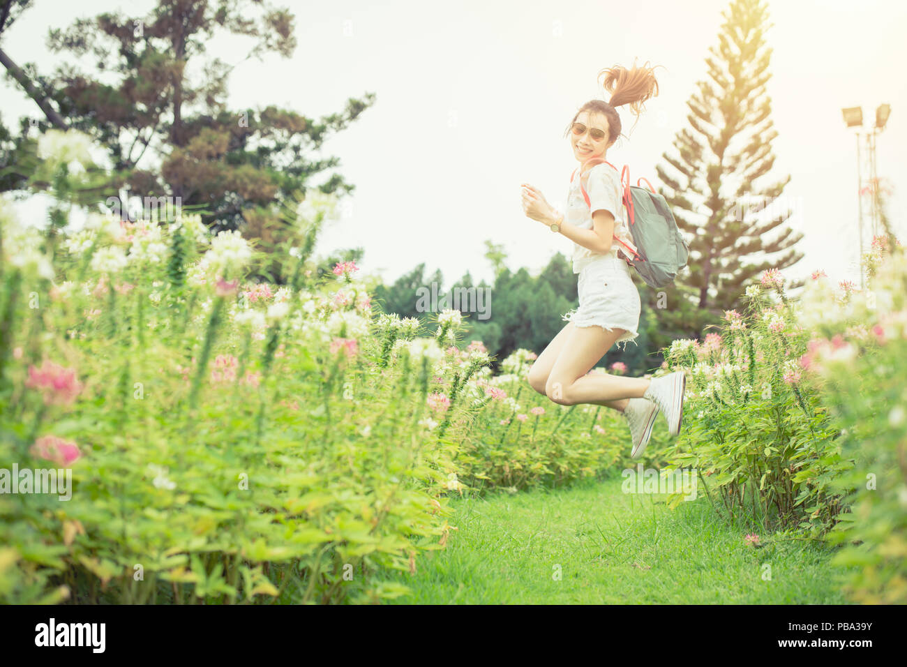 Girl cute teen life happiness jumping in the park outdoor Stock Photo