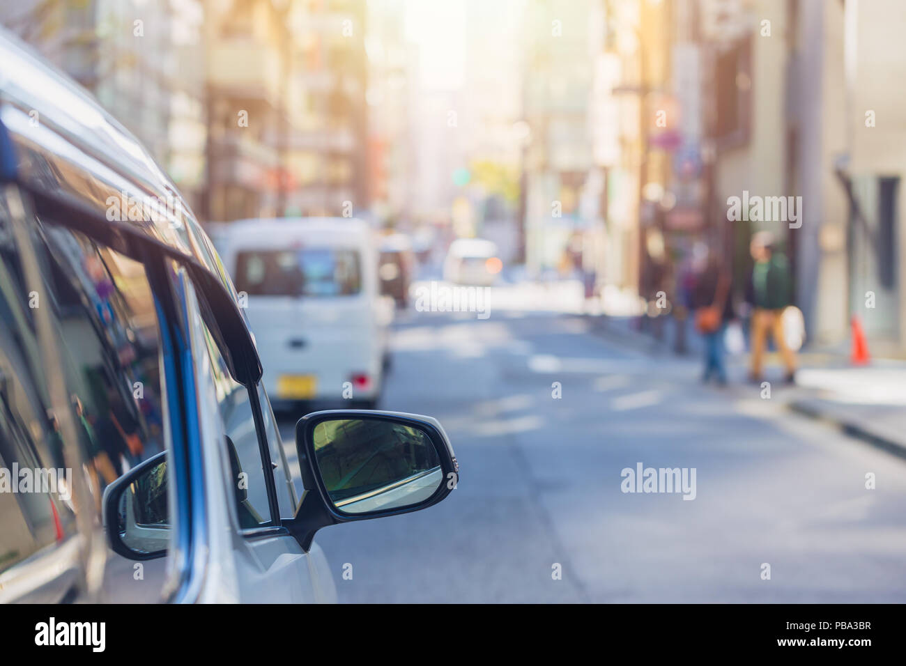 car driver parking the city urban road view blur in the morning background Stock Photo