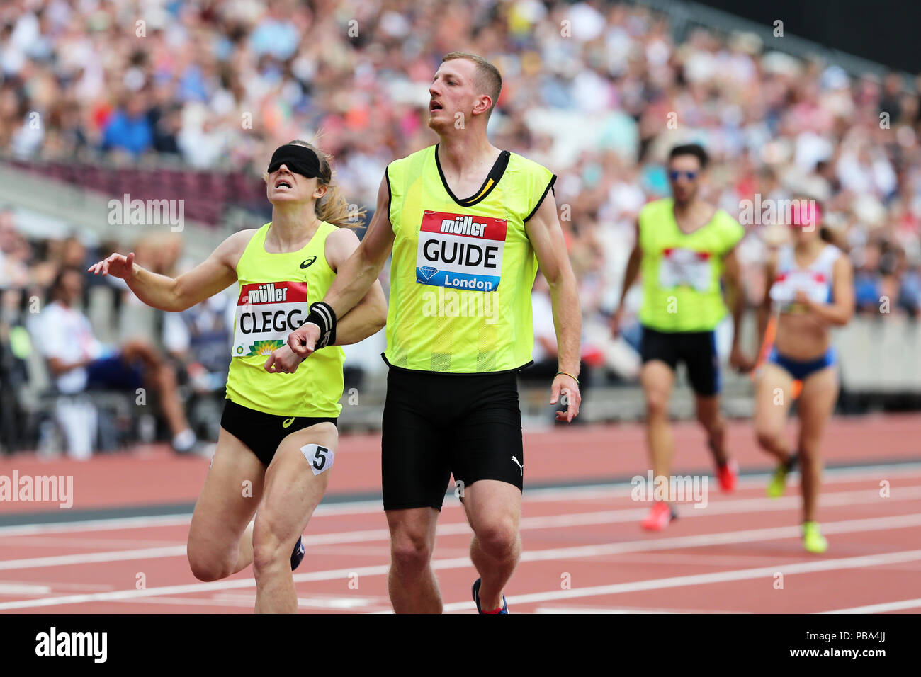 Libby CLEGG (Great Britain) with guide Tom SOMERS crossing the finish line in the Women's 200m T11 Final at the 2018, IAAF Diamond League, Anniversary Games, Queen Elizabeth Olympic Park, Stratford, London, UK. Stock Photo