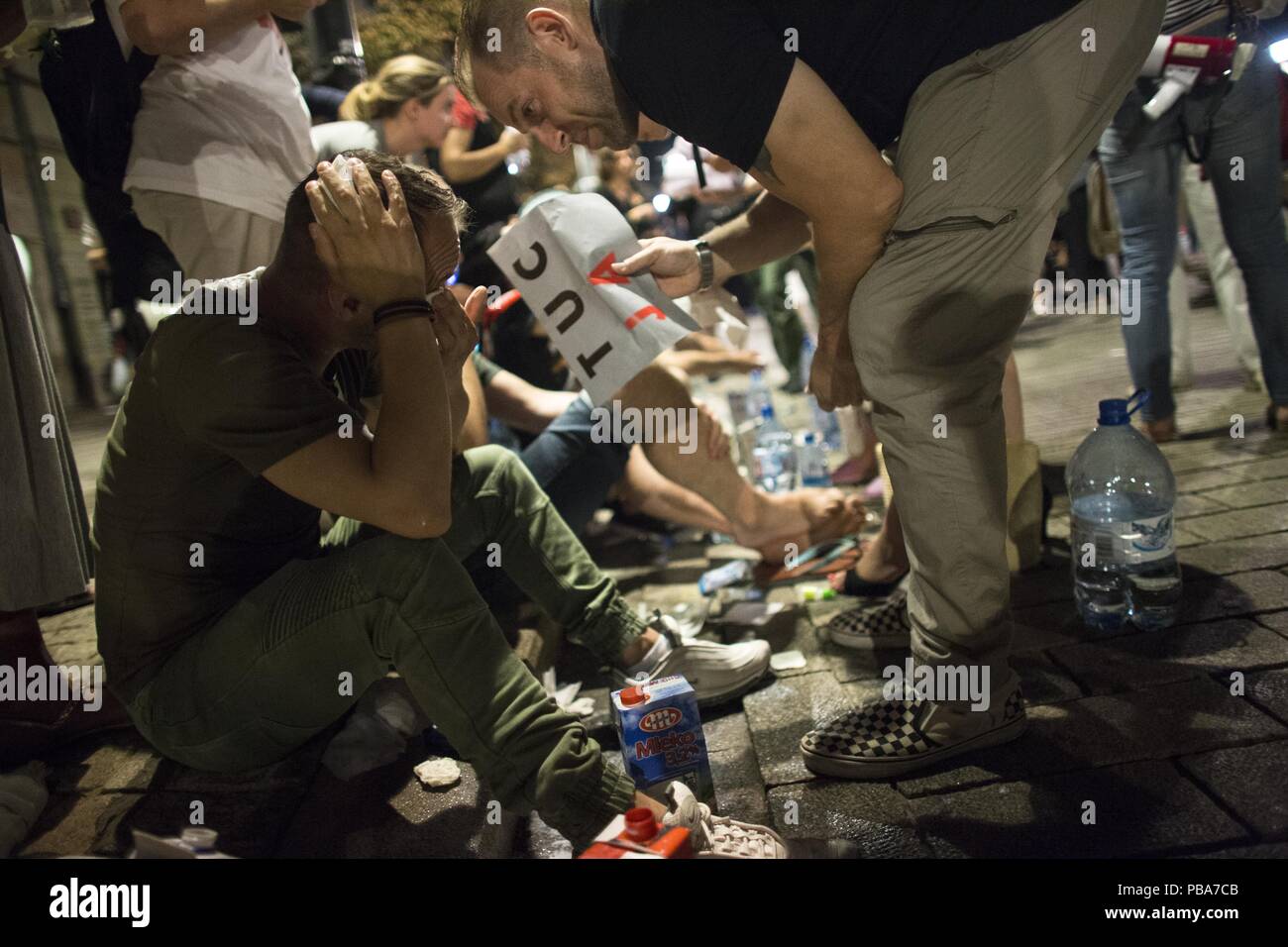 Police used pepper spray against protesters who gathered in front of the Presidential Palace on July 26, 2018 in Warsaw, Poland  to show  their rage a Stock Photo