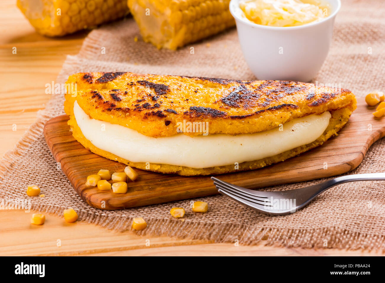 Cachapa with cheese, typical Venezuelan dish made with corn, cheese and butter Stock Photo