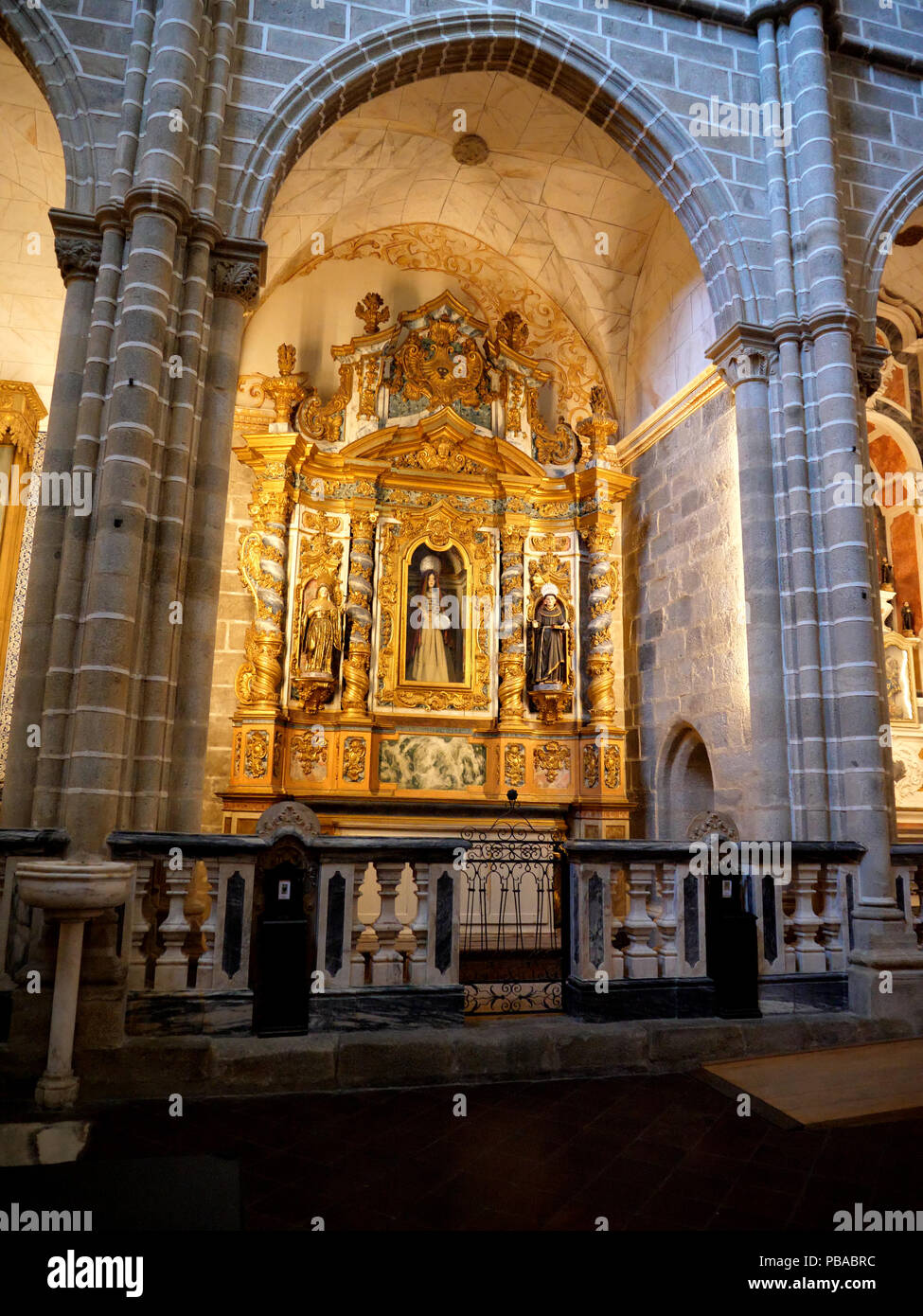 The main interior of the massive 12-century gothic Cathedral of the city of Evora in the Alentejo region of Portugal Stock Photo