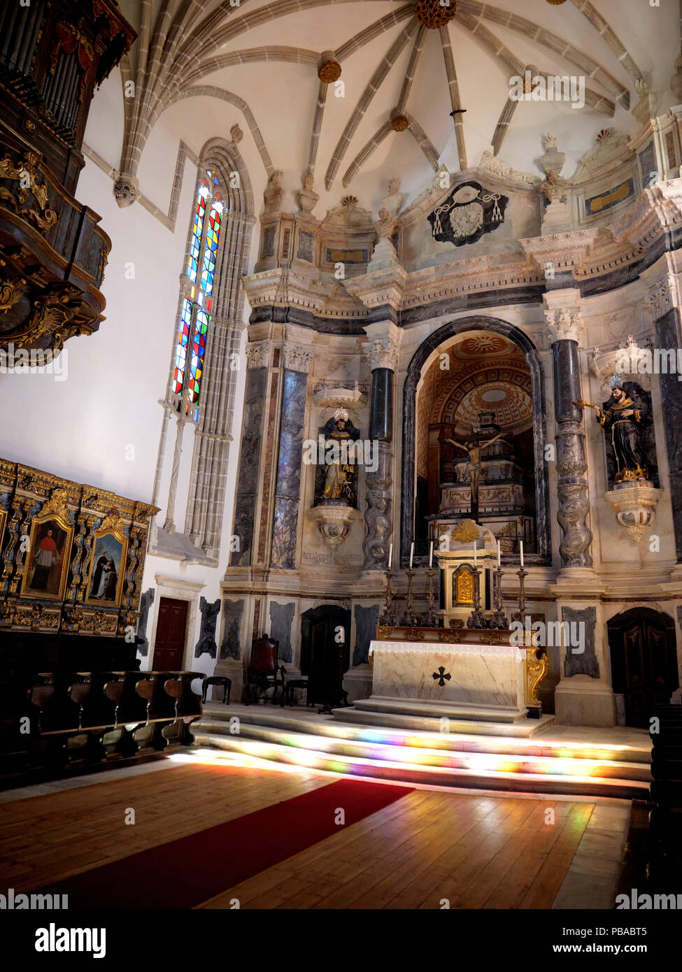 The main interior of the massive 12-century gothic Cathedral of the city of Evora in the Alentejo region of Portugal Stock Photo