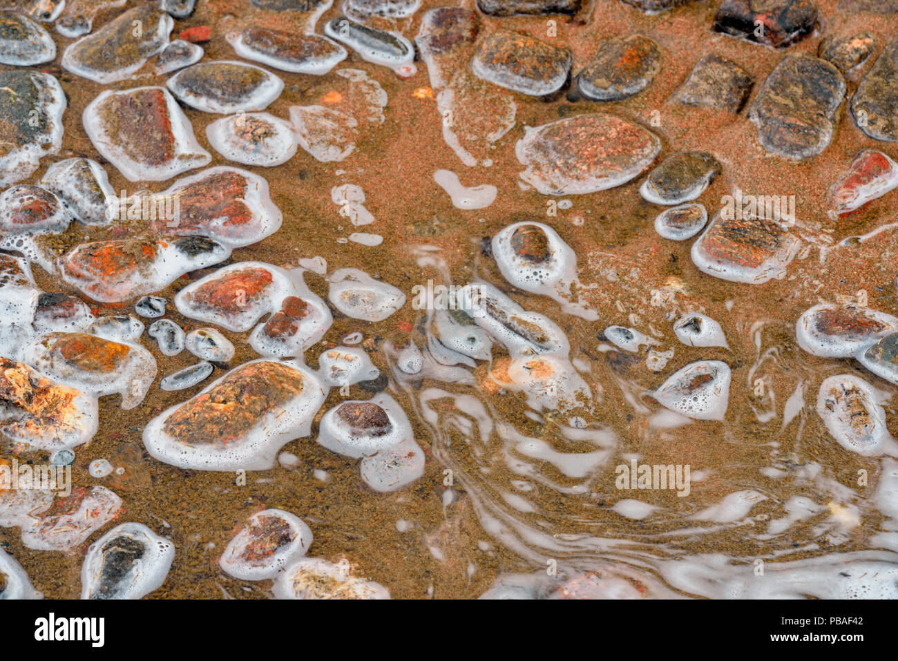 Foam patterns and shoreline rocks along Ennadai Lake, Arctic Haven
